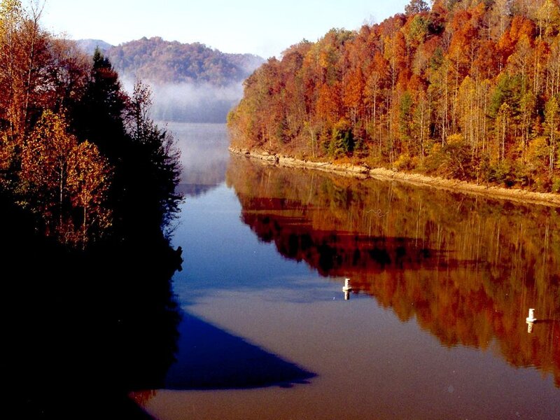 autumn river with forest reflection