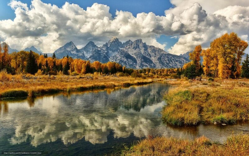 Autumn river with mountain reflection