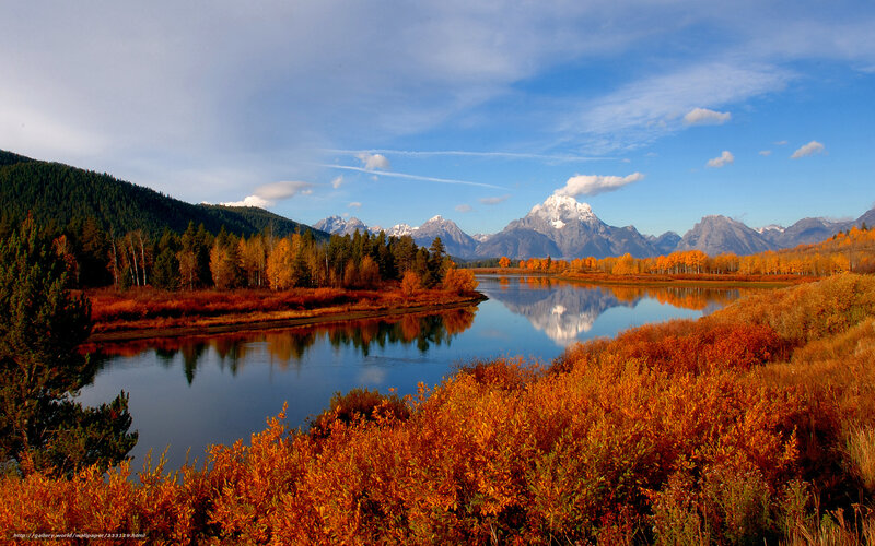 Autumn river with mountain reflection