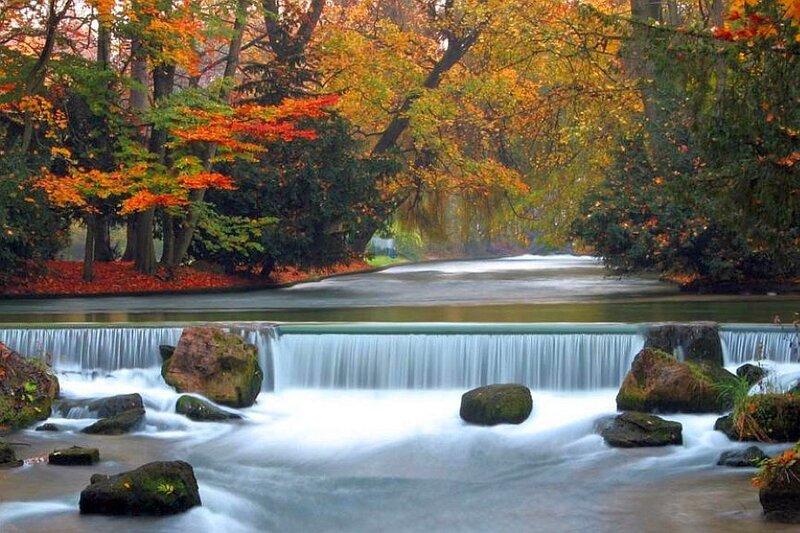 Autumn river with waterfall