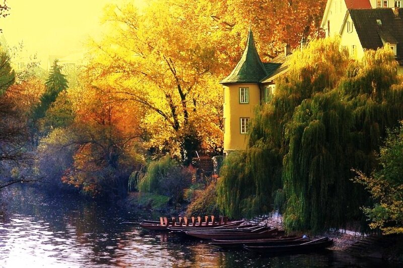 Autumn riverside with boats