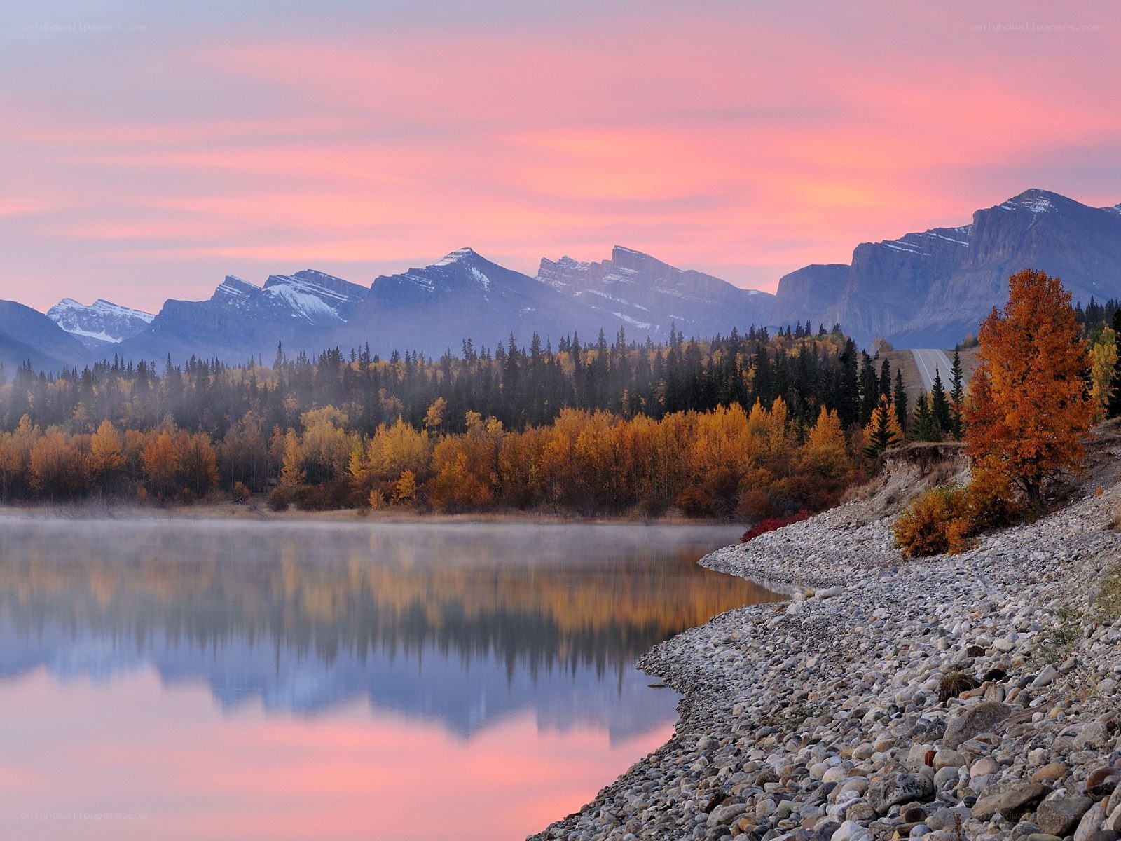 Autumn sunset over mountain lake