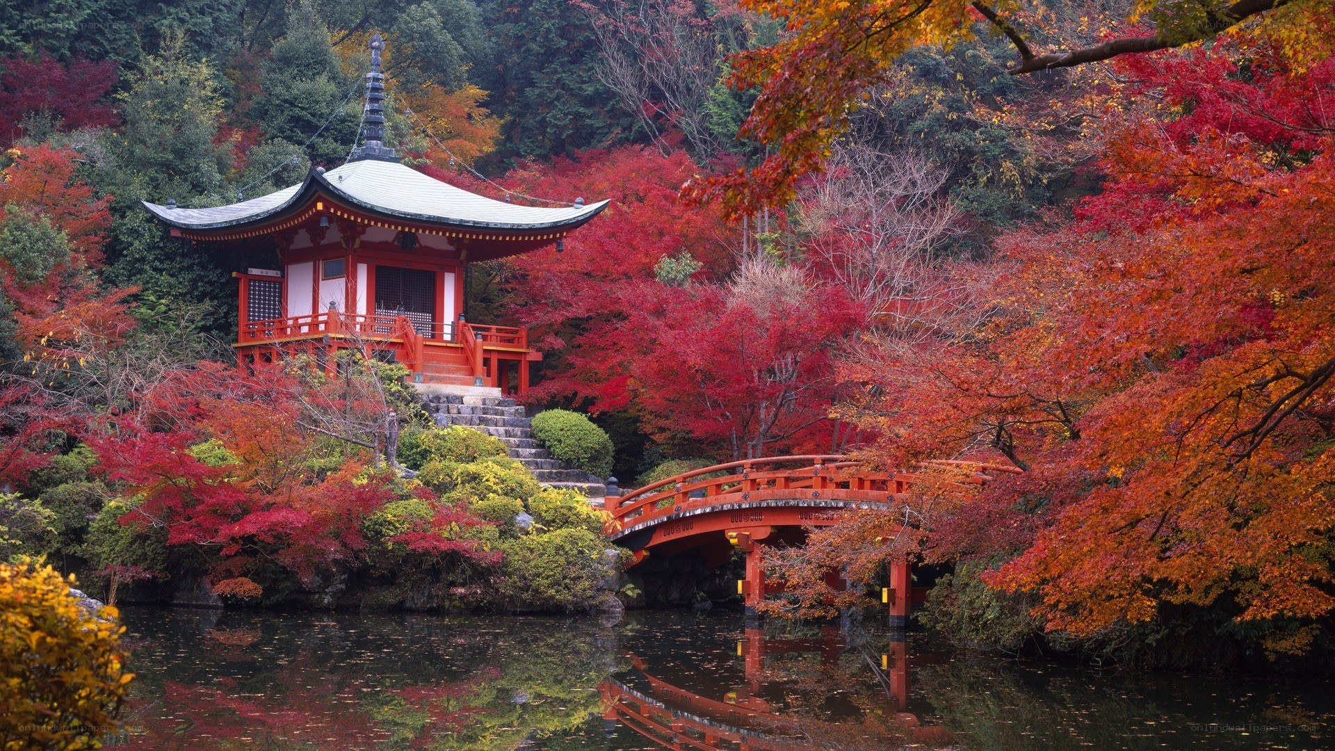 Autumn temple by a pond