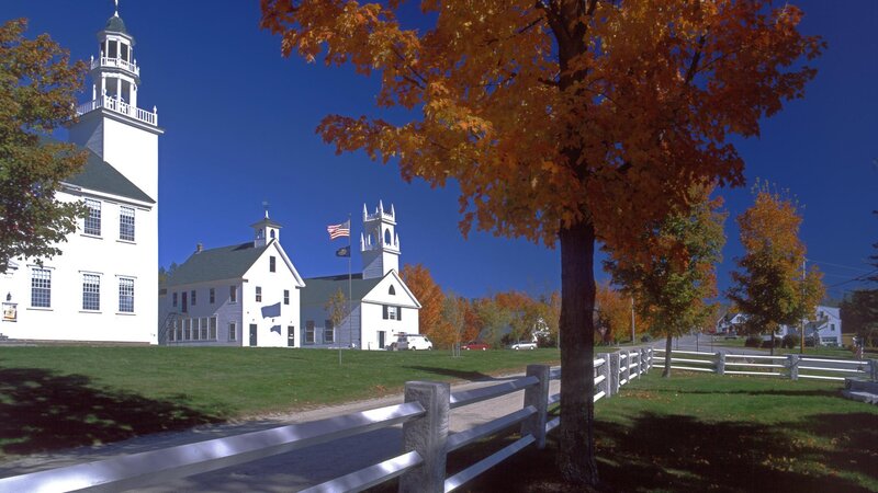 Autumn town square with white buildings