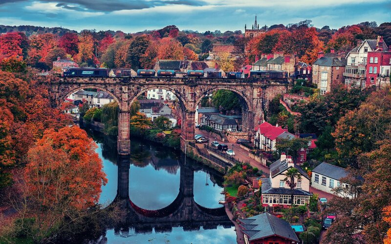 Autumn town with railway bridge