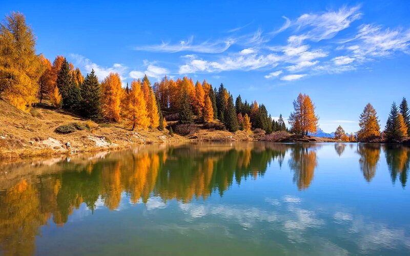 Autumn Trees by Lake — Blue, Serene, Photograph, Sky, Mountains