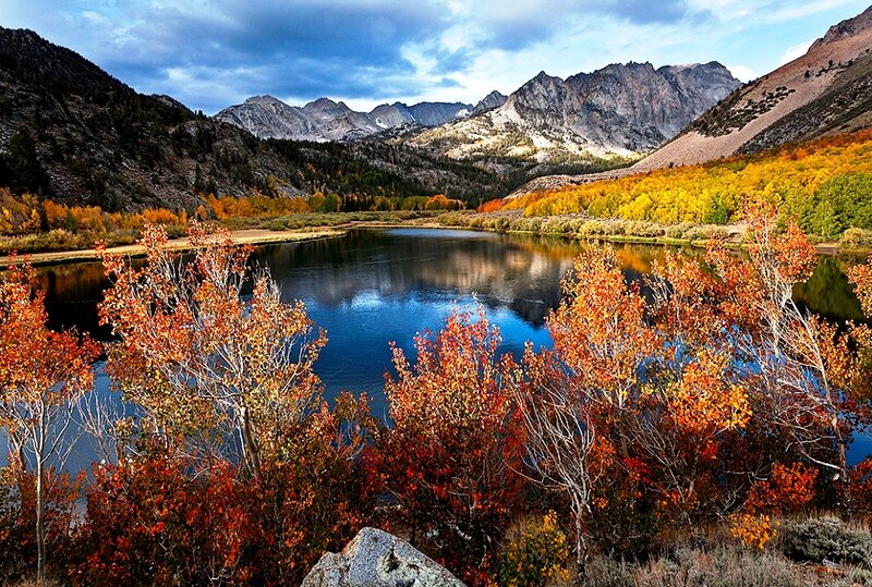 Autumn Trees by Lake — Orange, Serene, Photograph, Mountains, Sky