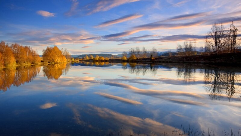 Autumn Trees Reflecting in Lake — Blue, Serene, Sunset, Photograph, Mountains, Sky