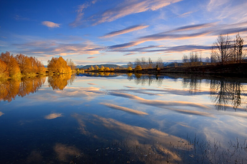 Autumn Trees Reflecting in Lake — Blue, Serene, Sunset, Photograph, Mountains