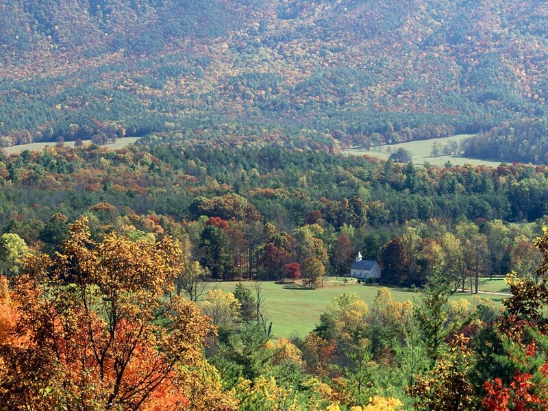 Autumn valley with church