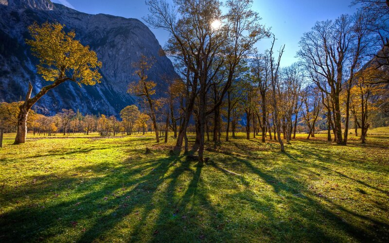 Autumn valley with mountain backdrop