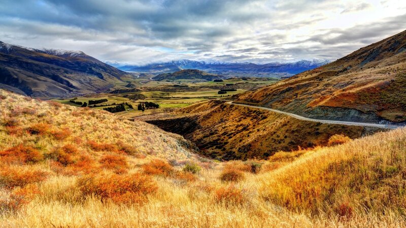 Autumn valley with winding road