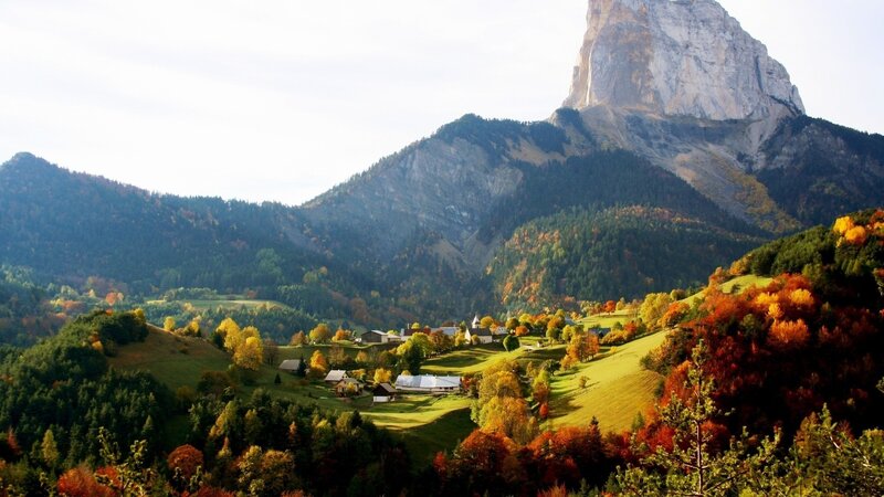 Autumn village in mountain valley