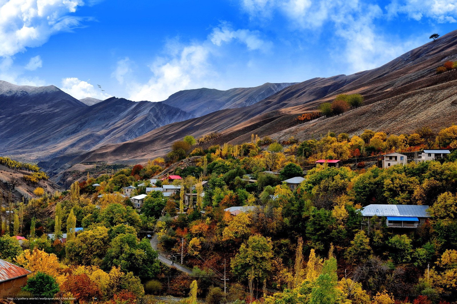 Autumn village in mountain valley