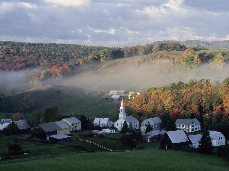 Autumn village in the mist
