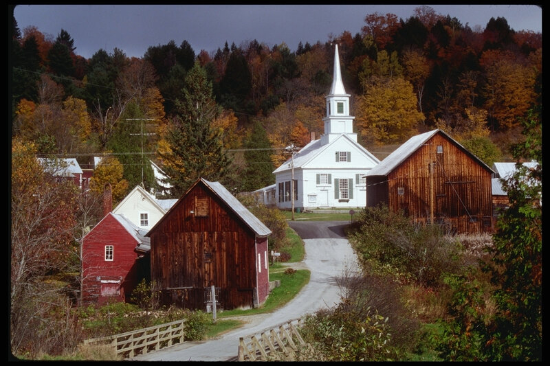 Autumn village with church