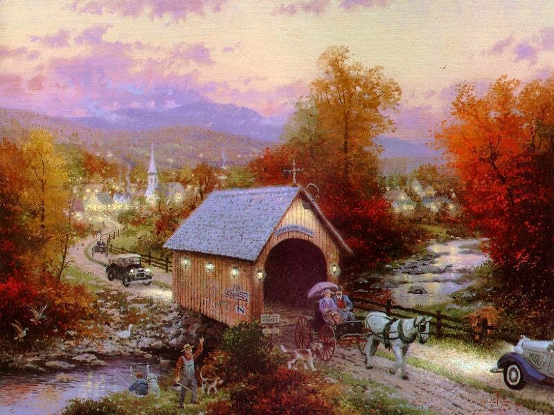 Autumn village with covered bridge