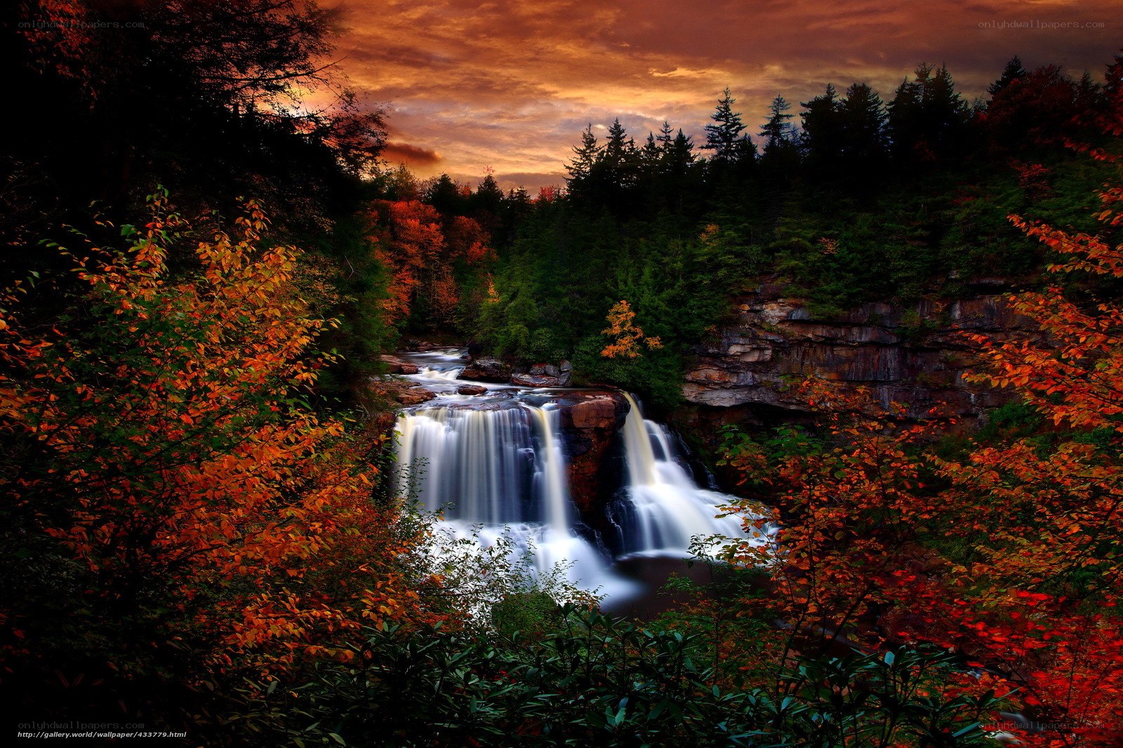 Autumn waterfall at sunset