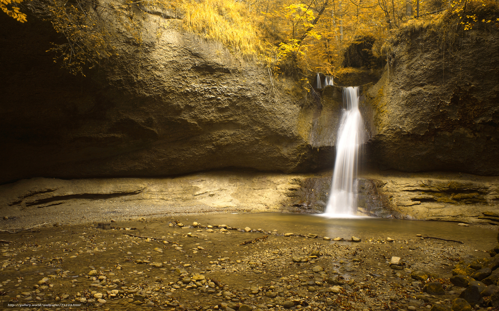 Autumn waterfall in a canyon