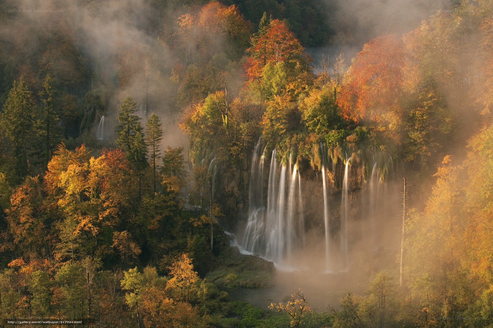 Autumn waterfall in mist