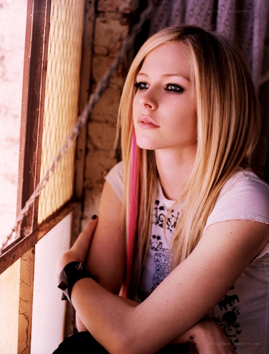 Avril Lavigne by a window