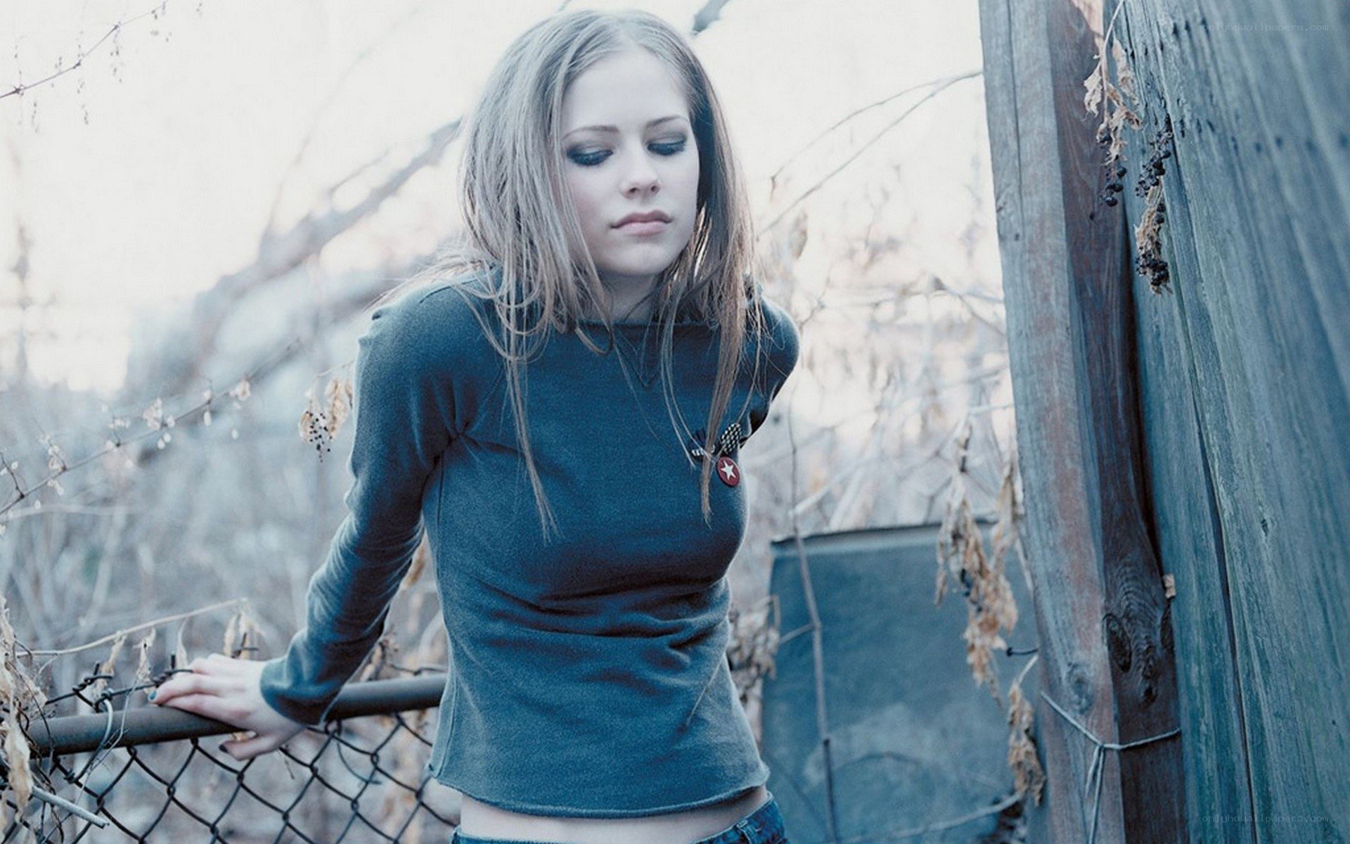 Avril Lavigne in a blue sweater