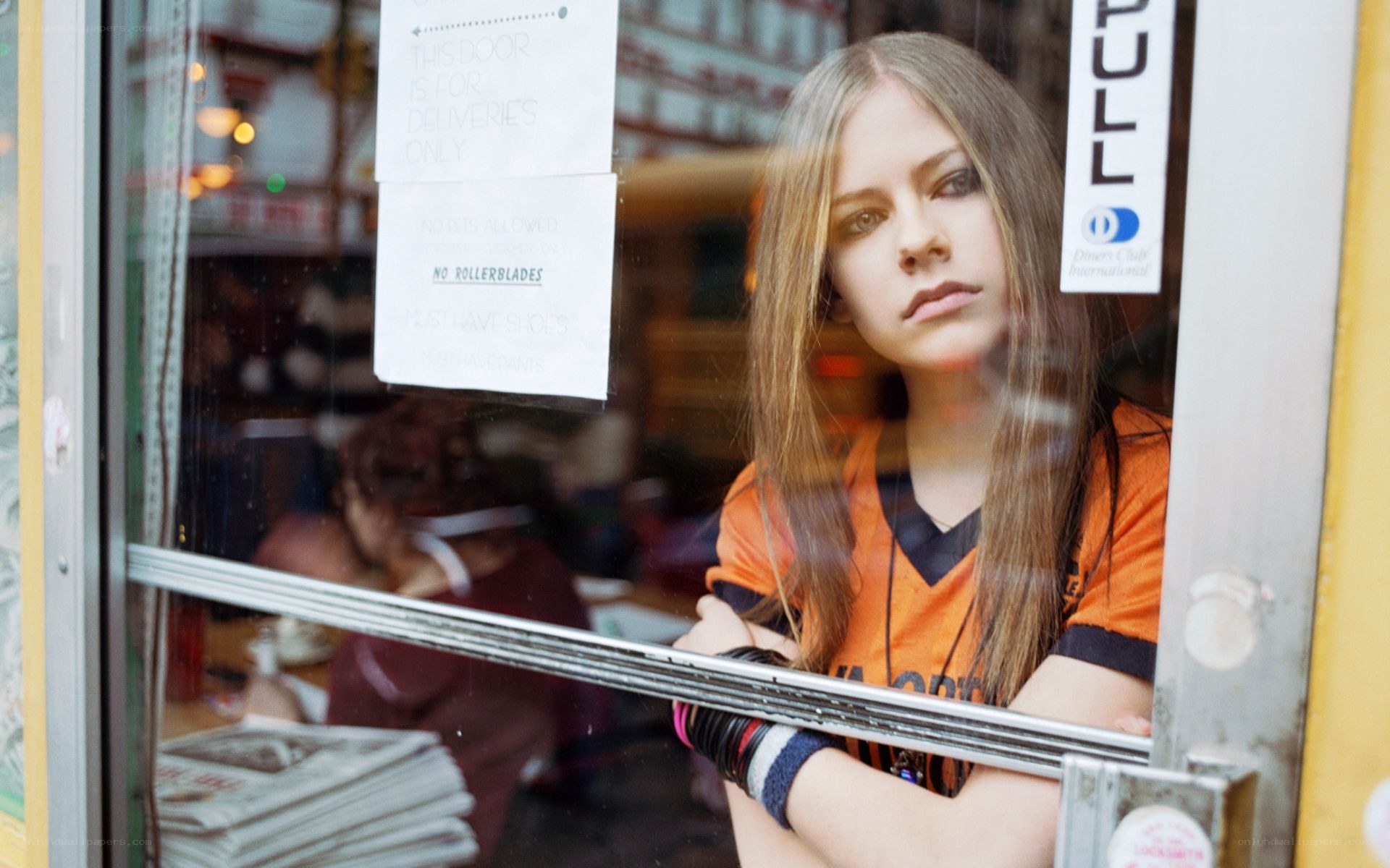Avril Lavigne in a cafe window