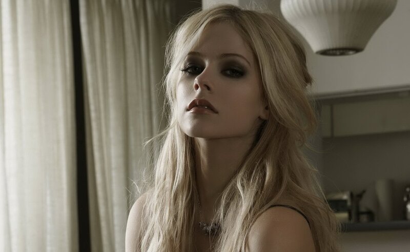Avril Lavigne in a contemplative pose