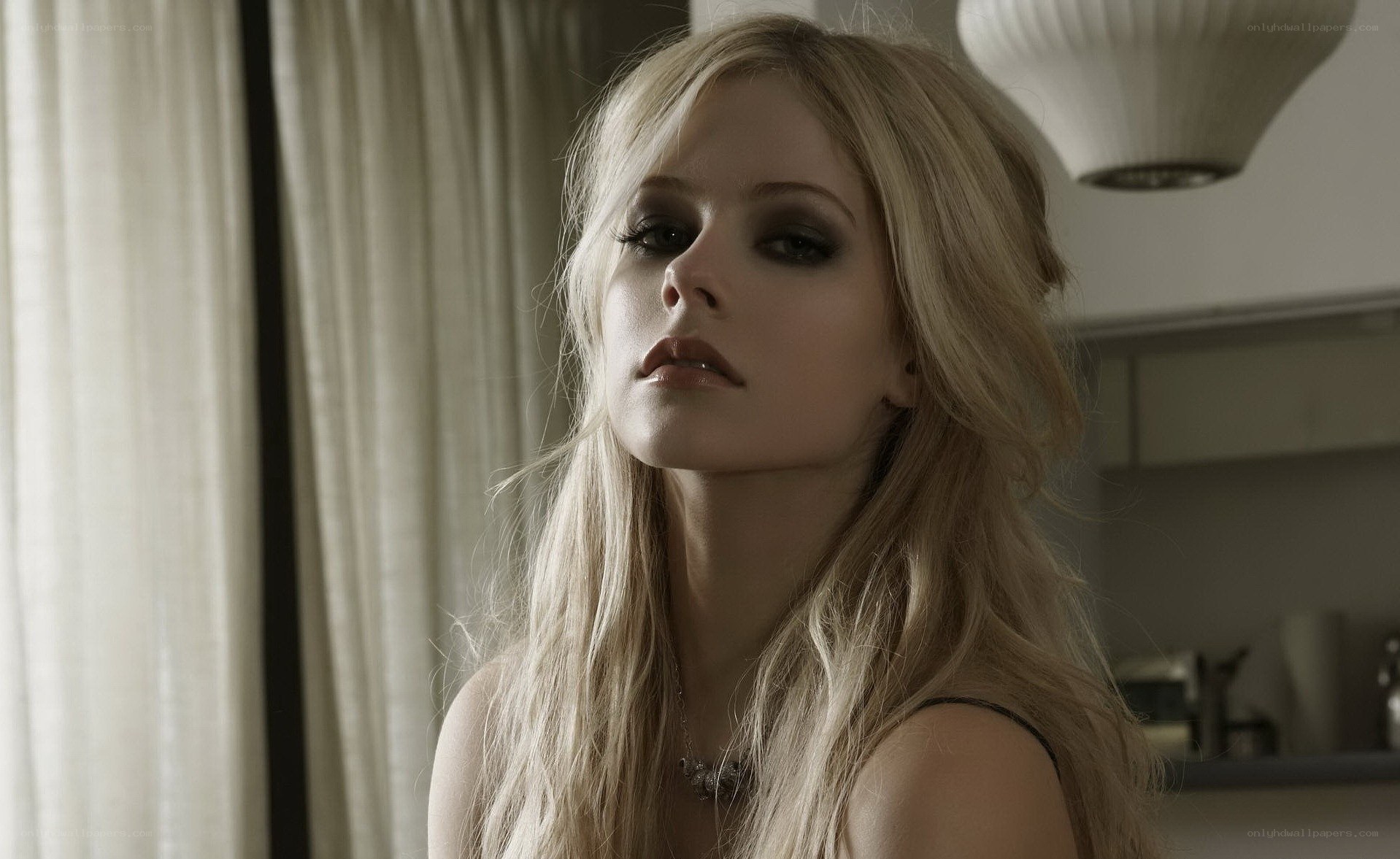 Avril Lavigne in a contemplative pose
