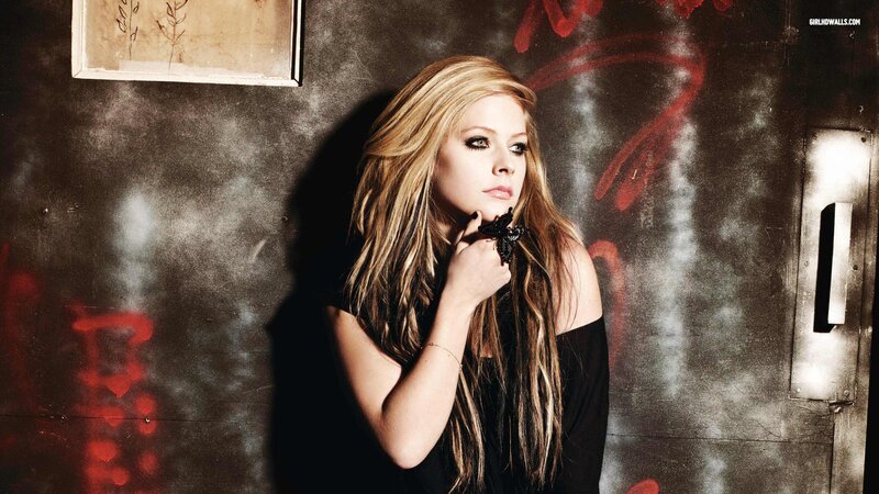 Avril Lavigne in a dark setting