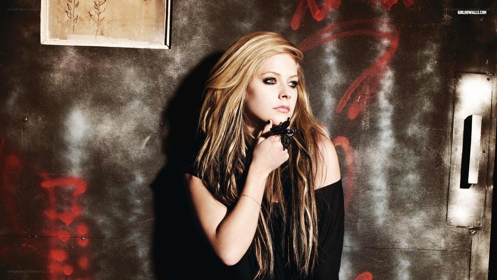 Avril Lavigne in a dark setting