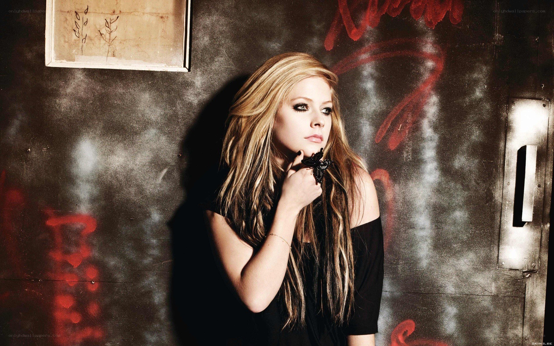 Avril Lavigne in a dark setting