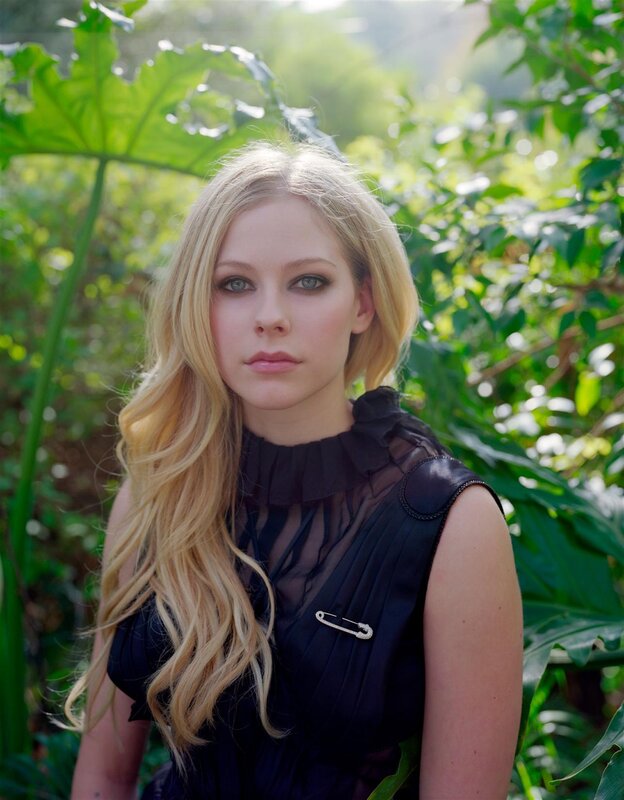 Avril Lavigne in a garden