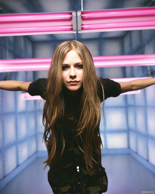 Avril Lavigne in a neon-lit room