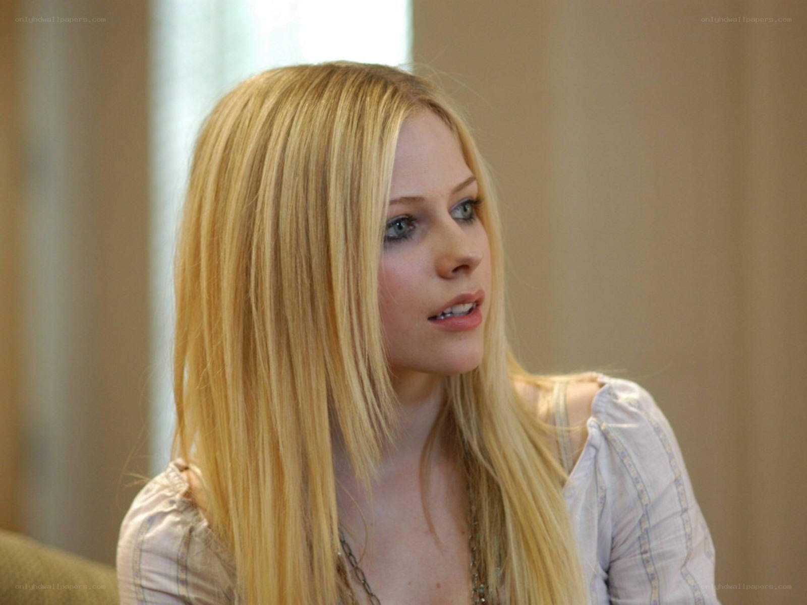 Avril Lavigne in a white blouse