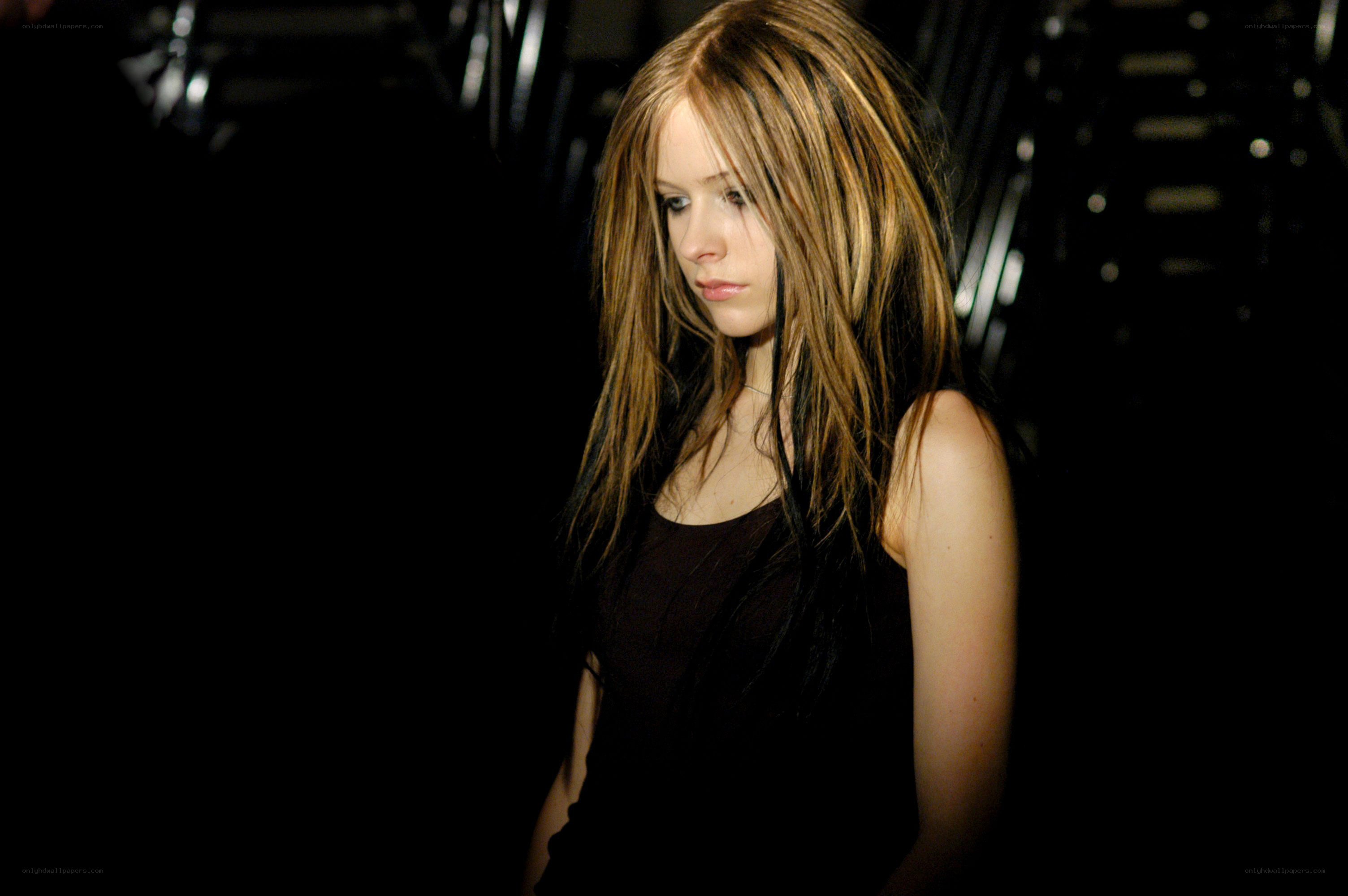Avril Lavigne in dark setting