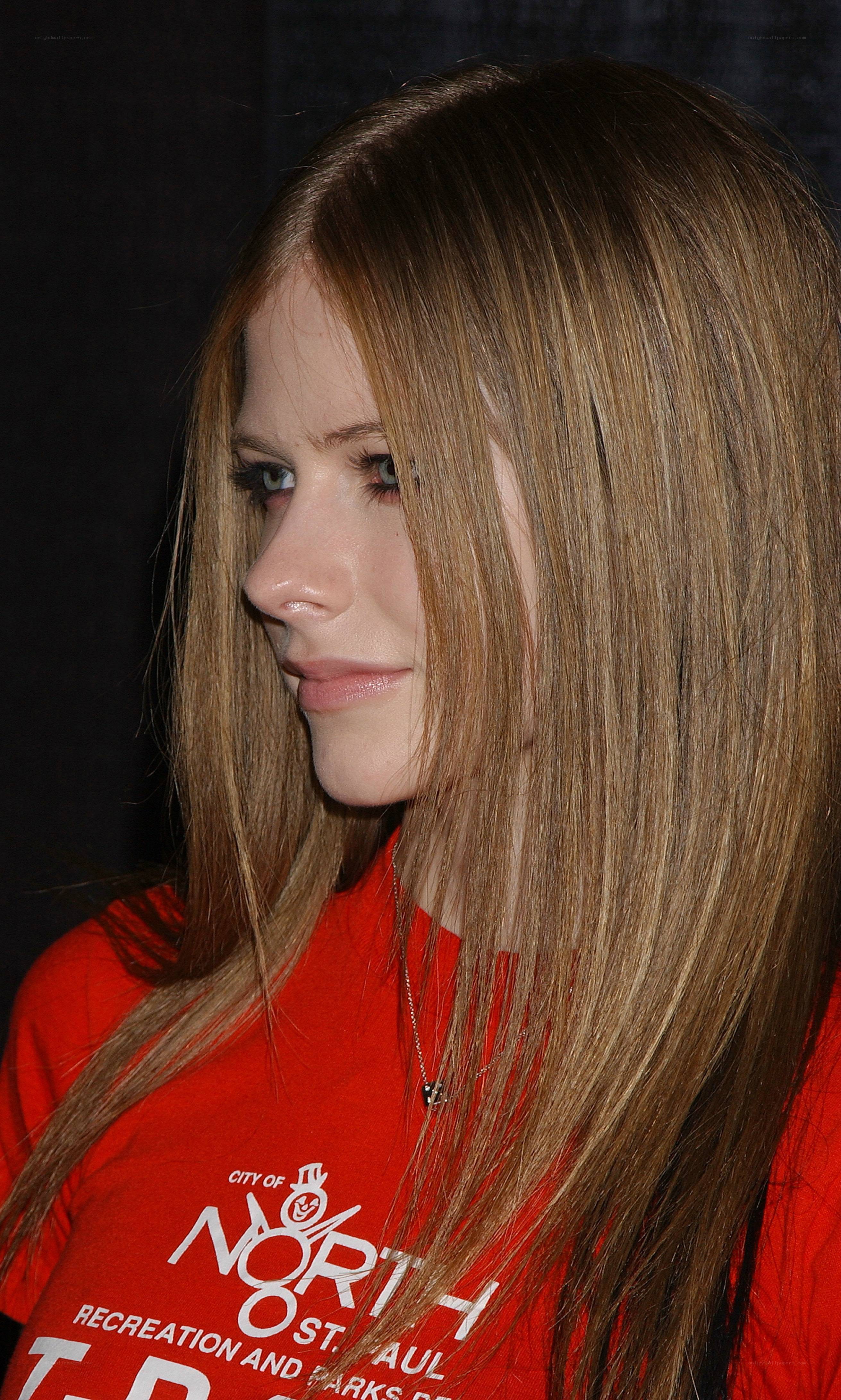 Avril Lavigne in red shirt