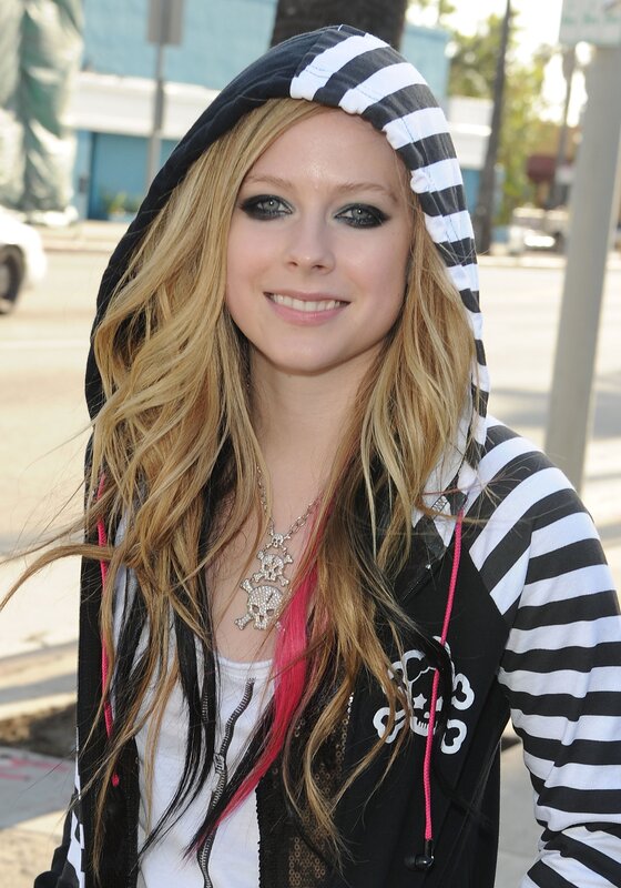 Avril Lavigne in striped hoodie