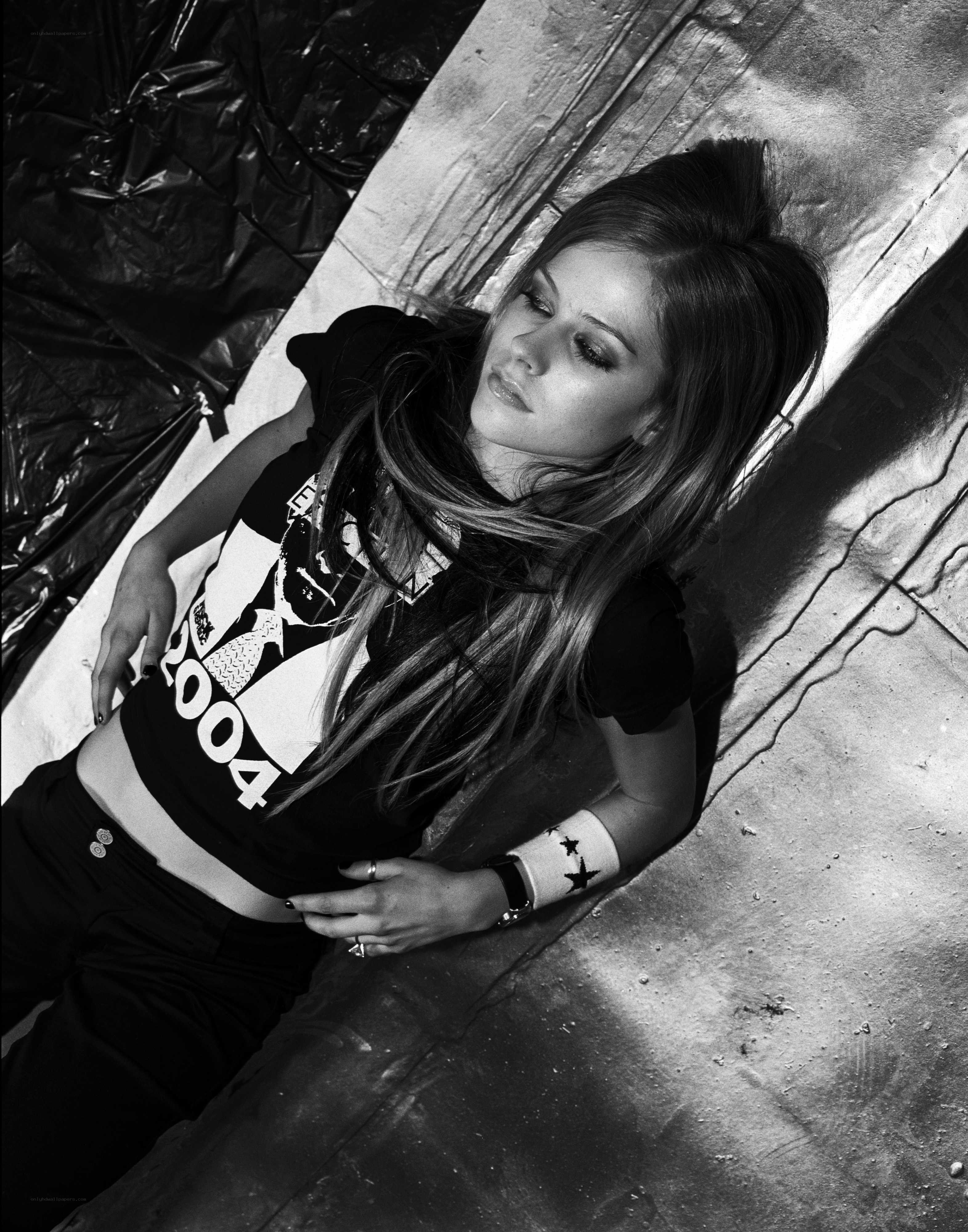Avril Lavigne lying on ground