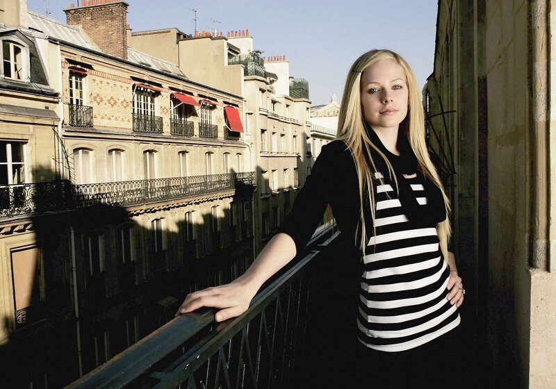 Avril Lavigne on a balcony in Paris