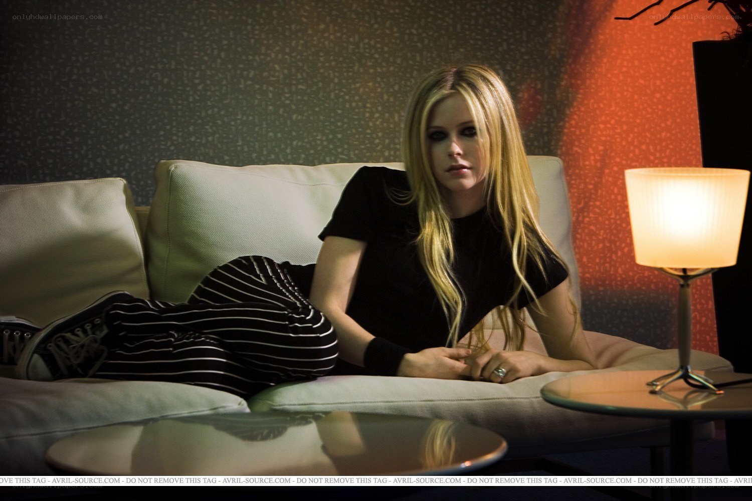 Avril Lavigne on a couch