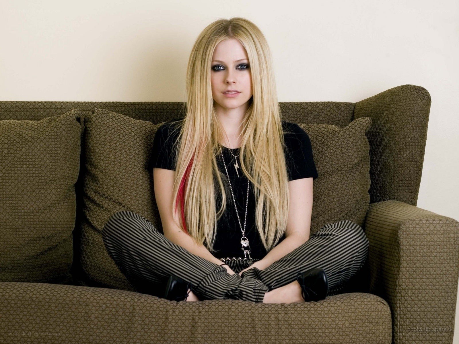 Avril Lavigne on a couch