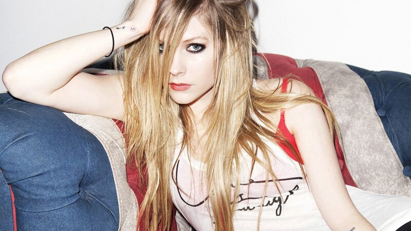 Avril Lavigne on a couch