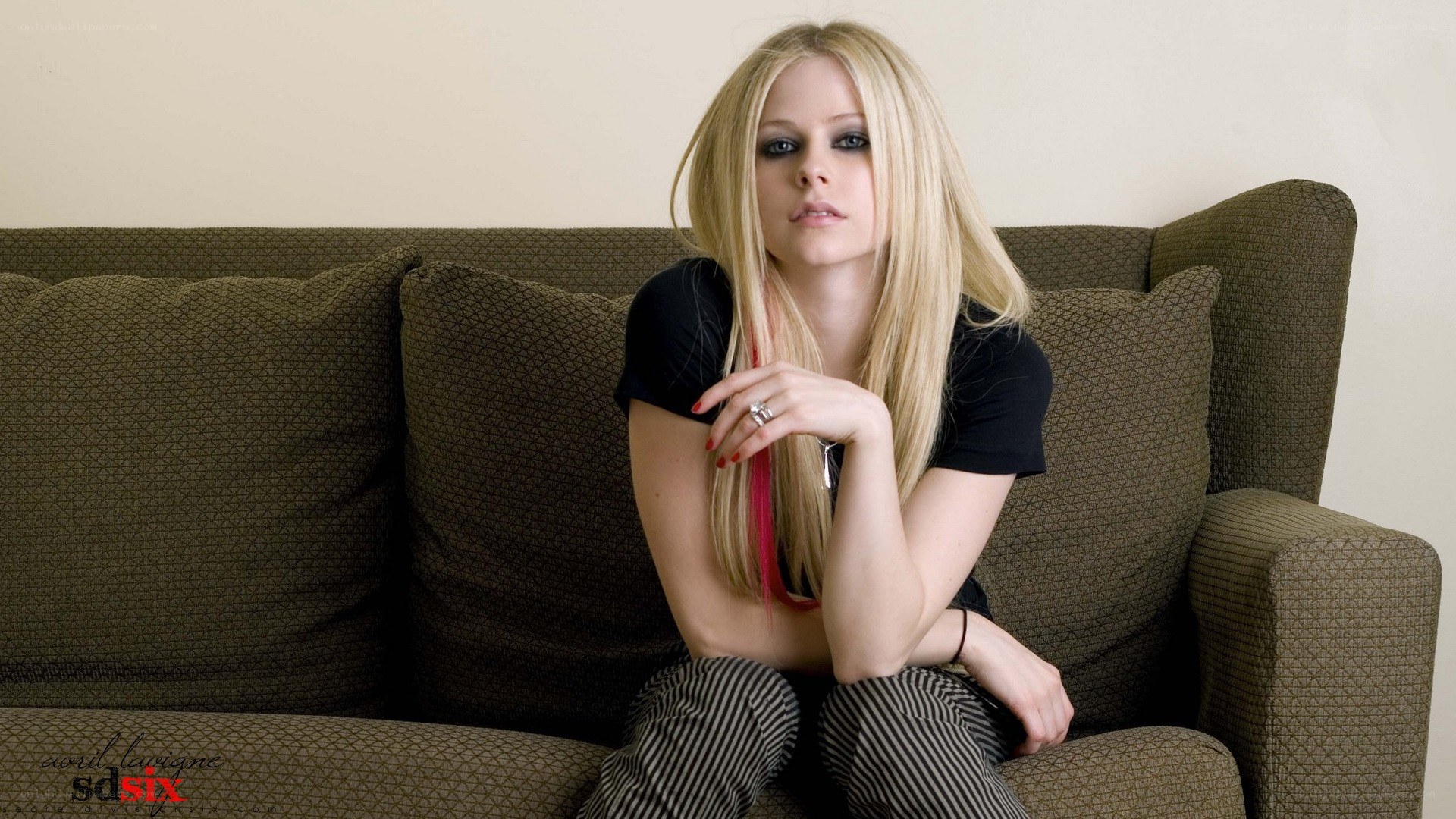 Avril Lavigne on a couch