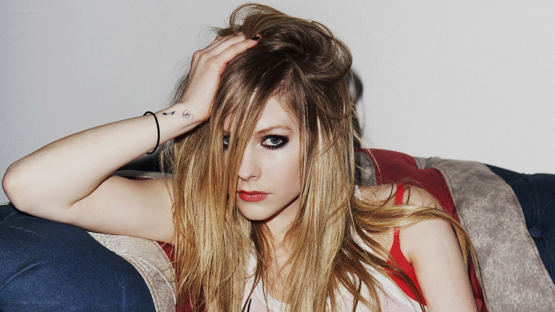 Avril Lavigne on a couch