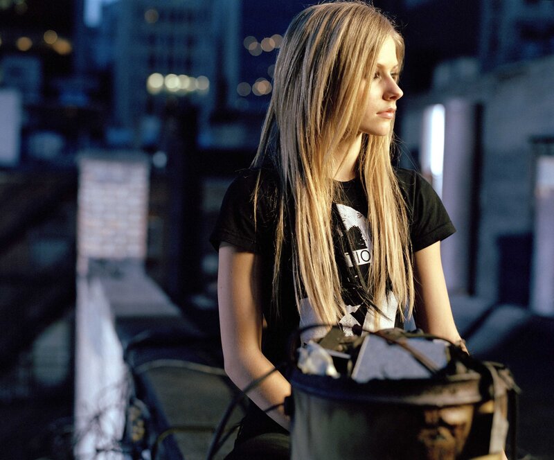 Avril Lavigne on a rooftop at night