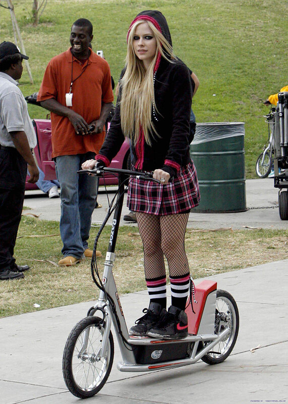 Avril Lavigne on a scooter