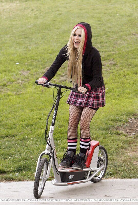 Avril Lavigne on a scooter