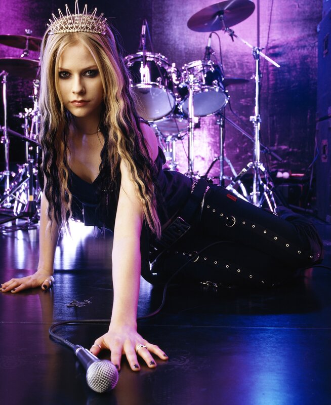 Avril Lavigne on stage with crown