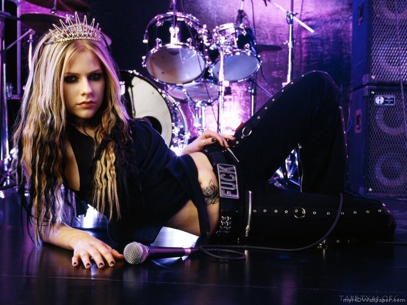 Avril Lavigne on stage with crown